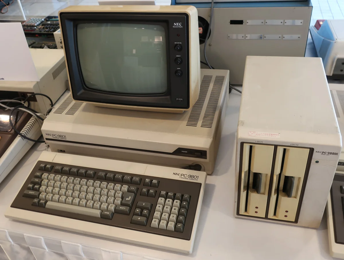 NEC PC-9801 with a monochrome monitor, keyboard and external floppy drives